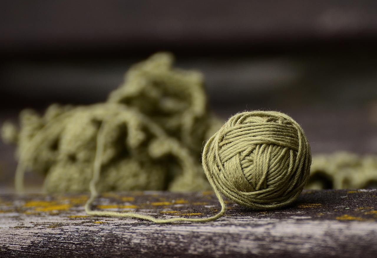 Soft yarn skeins and crochet tools